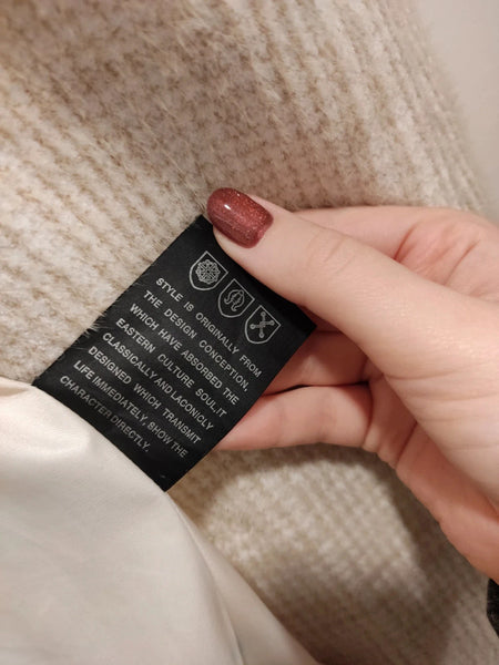 Kreminės/baltos spalvos paltas